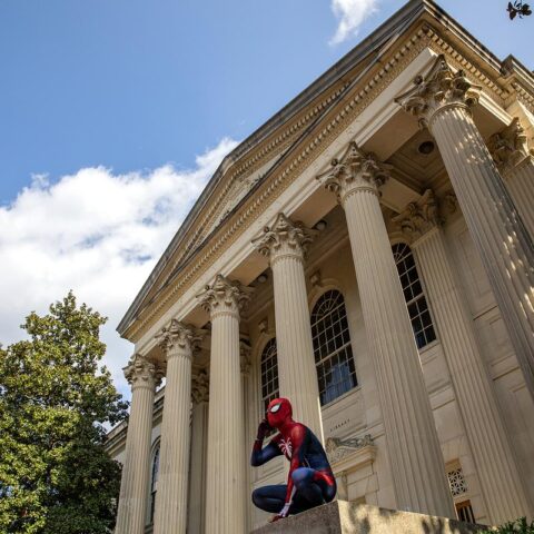 Spiderman sits outside Wilson Library