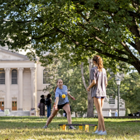Students play spikeball in the quad