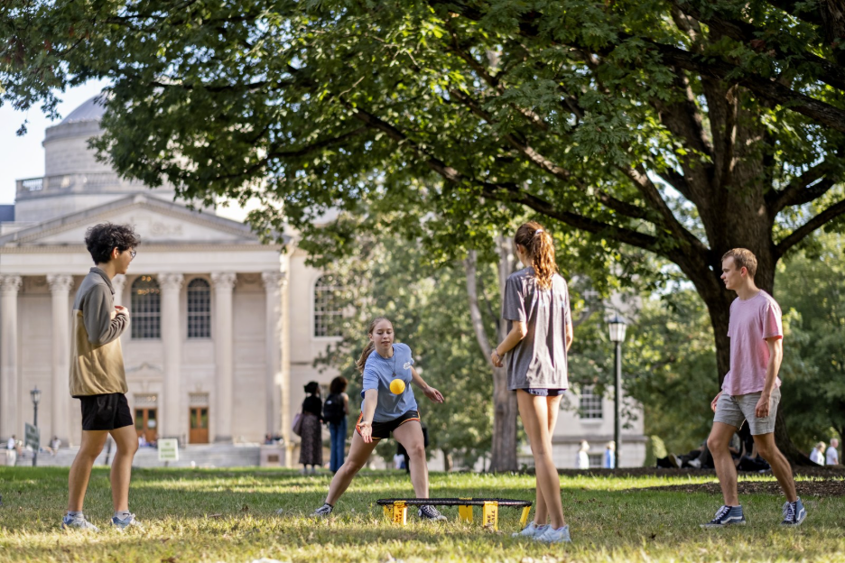 Students play spikeball in the quad